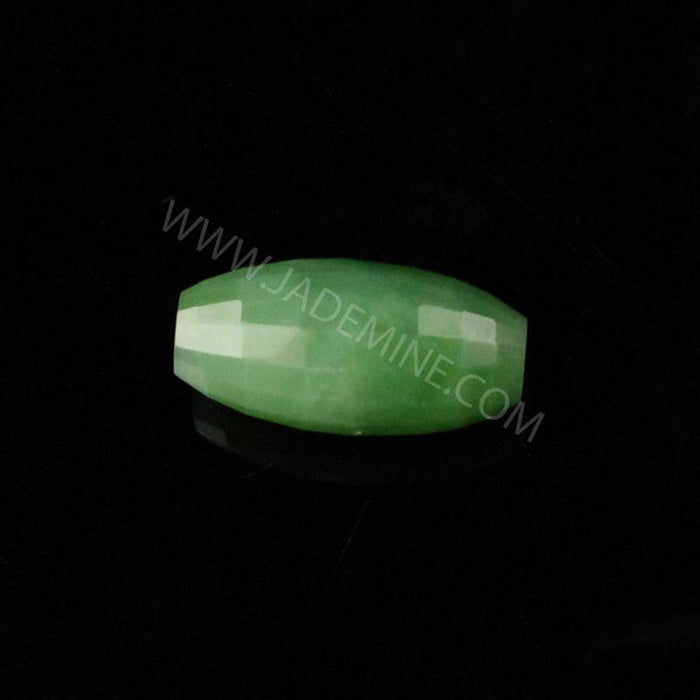 Single pale green faceted Siberian Bead 9x18mm on black background