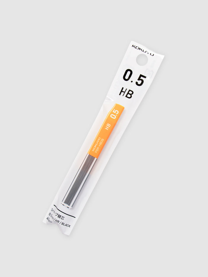 Kokuyo Pencil Lead, 0.5, HB, Cloth and Paper. Lead in its packaging turned to the right against a neutral background.