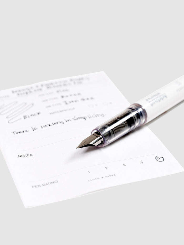 Kokuyo x Platinum Preppy Perpanep Fountain Pen, Cloth and Paper. Close up on pen nib resting on pen test sheet.