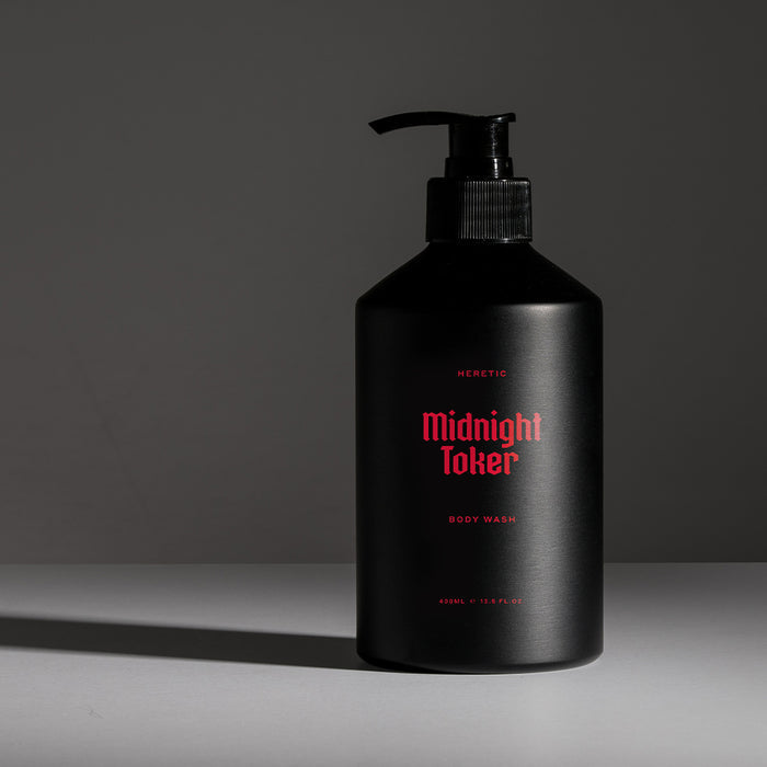 Black bottle of 'Midnight Toker' body wash with red text on a gray background