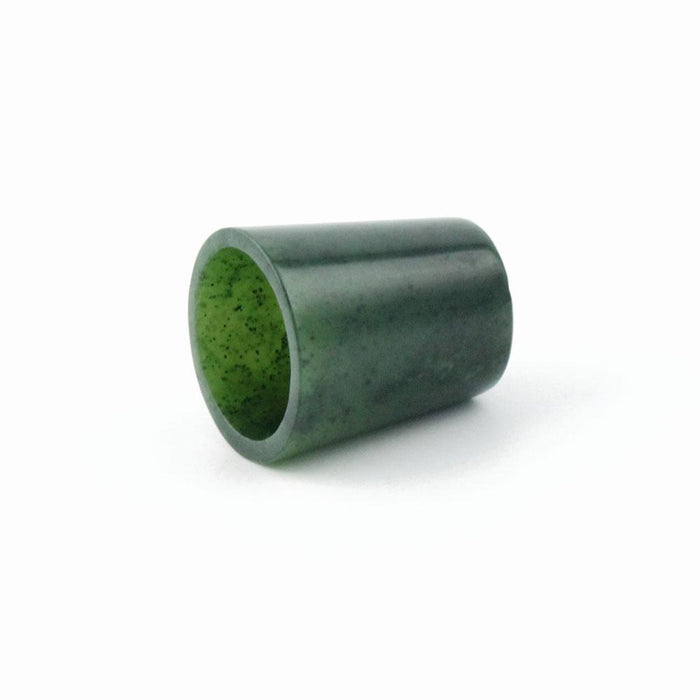 Green jade thimble with hollow center and speckled interior
