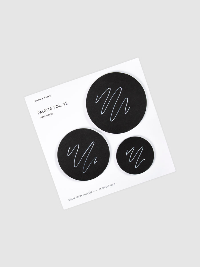 Uni Posca Paint Marker, Ultra Fine Point, White, Cloth and Paper. Marker writing sample displayed on Circle Sticky Note Set in Avant Garde or black paper.