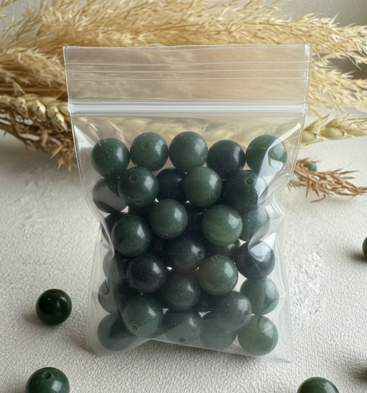 Clear bag of natural Canadian nephrite jade beads 7-8.5 mm mix