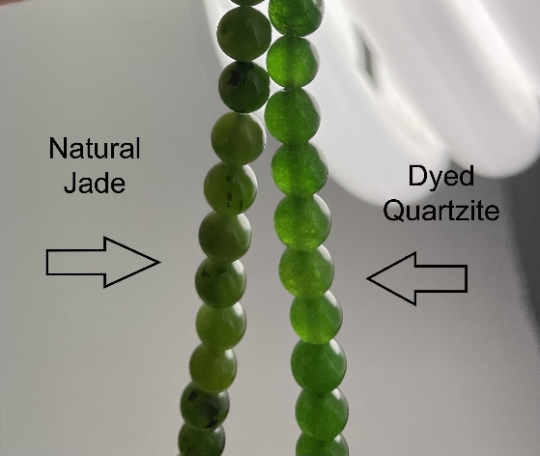Two strands of green beads labeled 'Natural Jade' and 'Dyed Quartzite' on a white background.