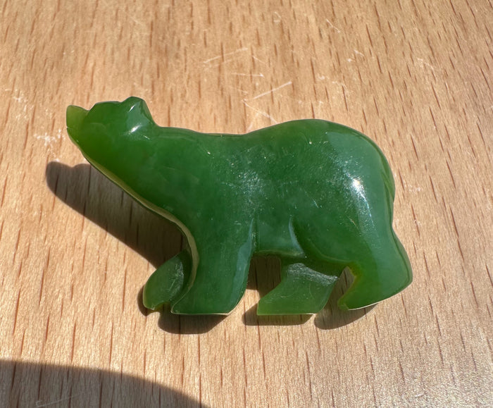 Green Siberian jade bear brooch carved as a standing bear with a metal pin on the back.