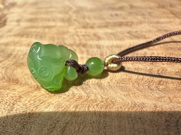 Apple Siberian Jade lotus seed pod pendant with extra small 9.5mm bead on dark cord