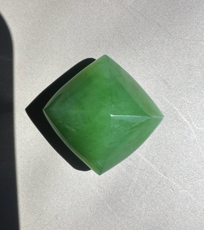 Green jade on a gray surface