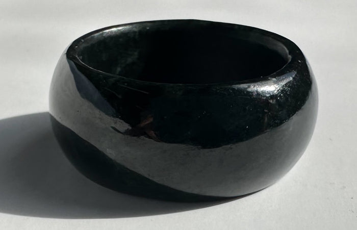 Glossy black jade wide band ring with smooth rounded edges