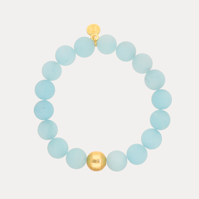 a blue beaded bracelet with a gold bead
