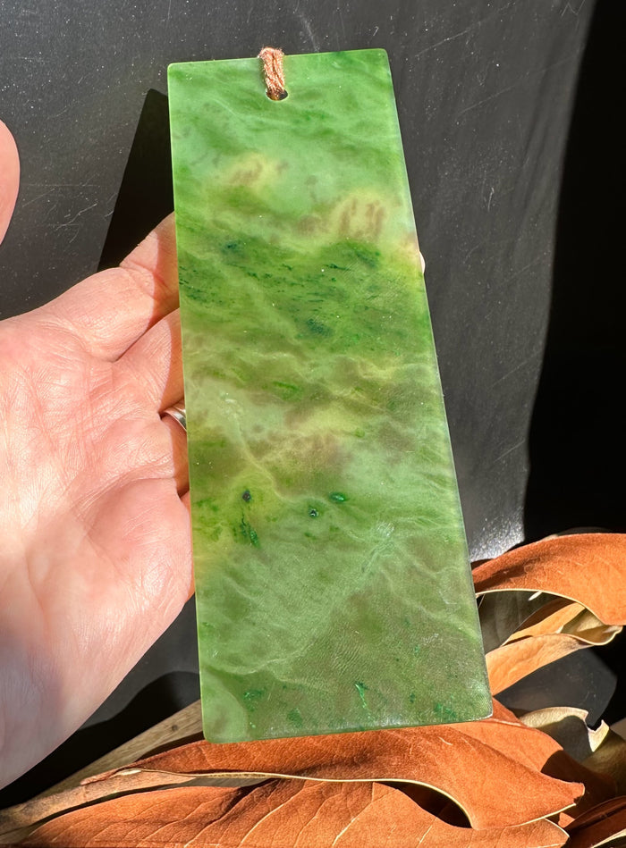Rectangular Canadian Jade bookmark with a copper loop at the top