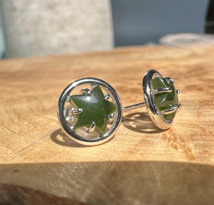 Circular silver stud earrings with a green jade star centerpiece