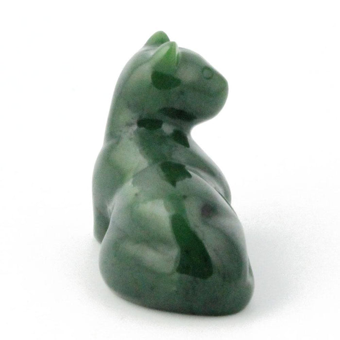 Green marbled cat statue in a seated pose.