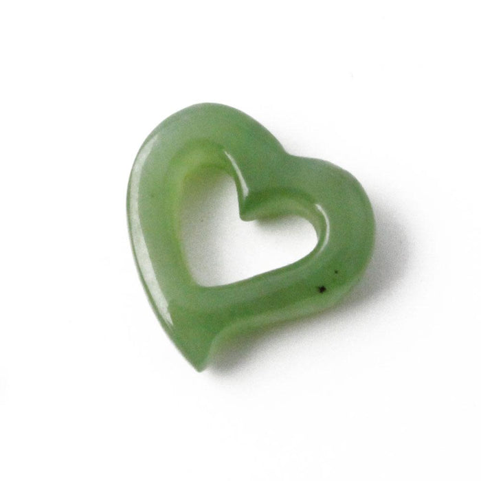 Green jade heart on a white background