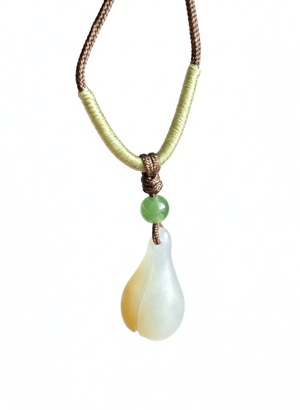 Dainty Honey White Nephrite Jade Pendant on pale yellow green wrapped cord with a small green bead.
