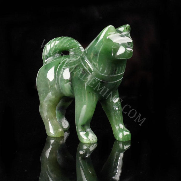 Green jade husky sculpture standing with tail curled over its back.