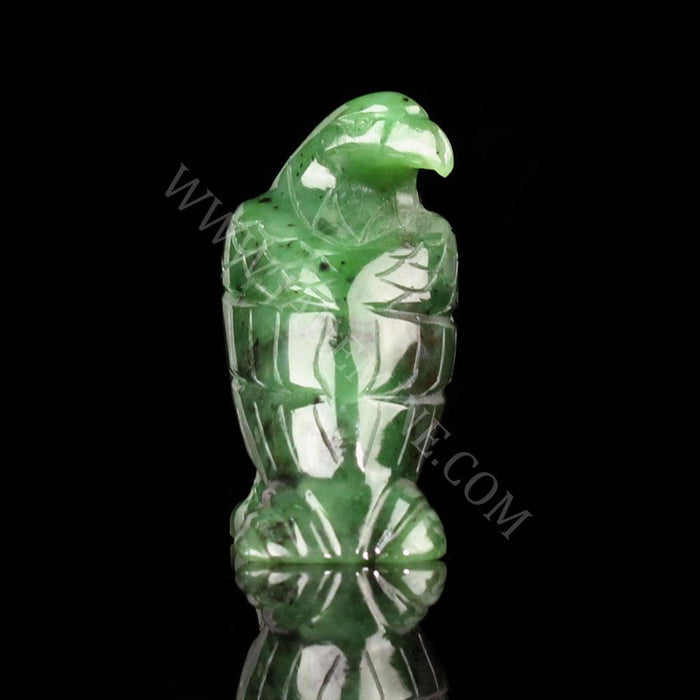 Green jade standing eagle viewed from the side with detailed chest feathers