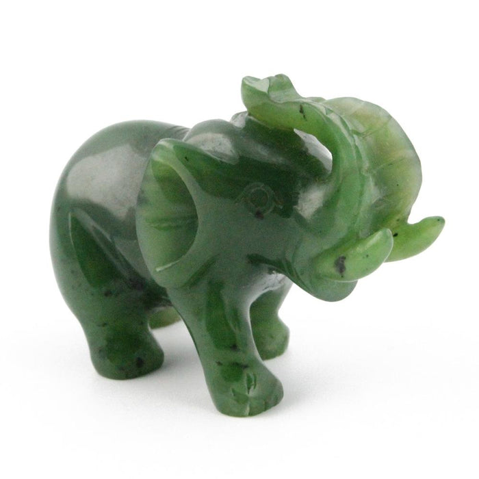 Green jade elephant carving on a white background