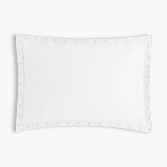 White pillowcase with embroidered star blue patterns on a white background
