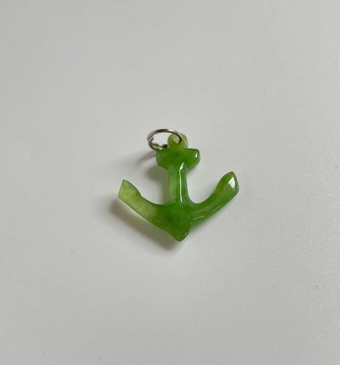 Green jade anchor charm with a silver loop for jewelry