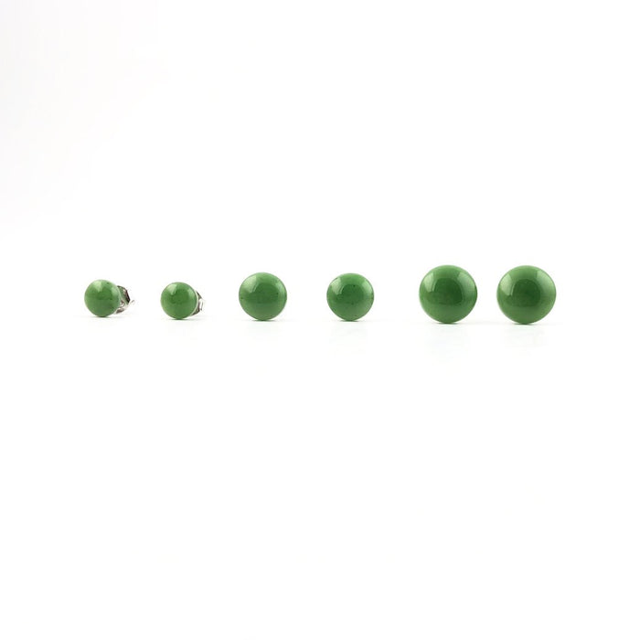 Set of jade flat stud earrings in multiple sizes arranged in a line on a white background.