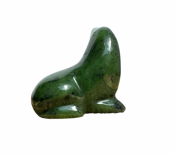 Smooth green jade seal stone with a rounded abstract shape and polished surface