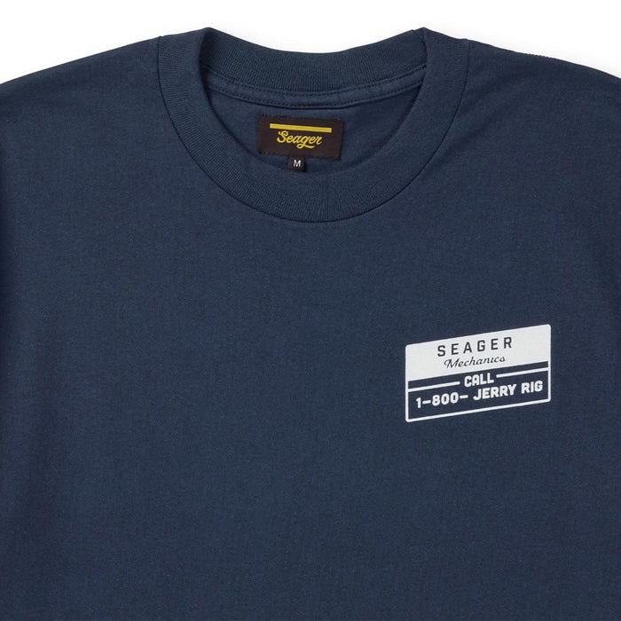 Close up of Seager Jerry Rig navy short sleeve t-shirt featuring small front chest mechanic logo print