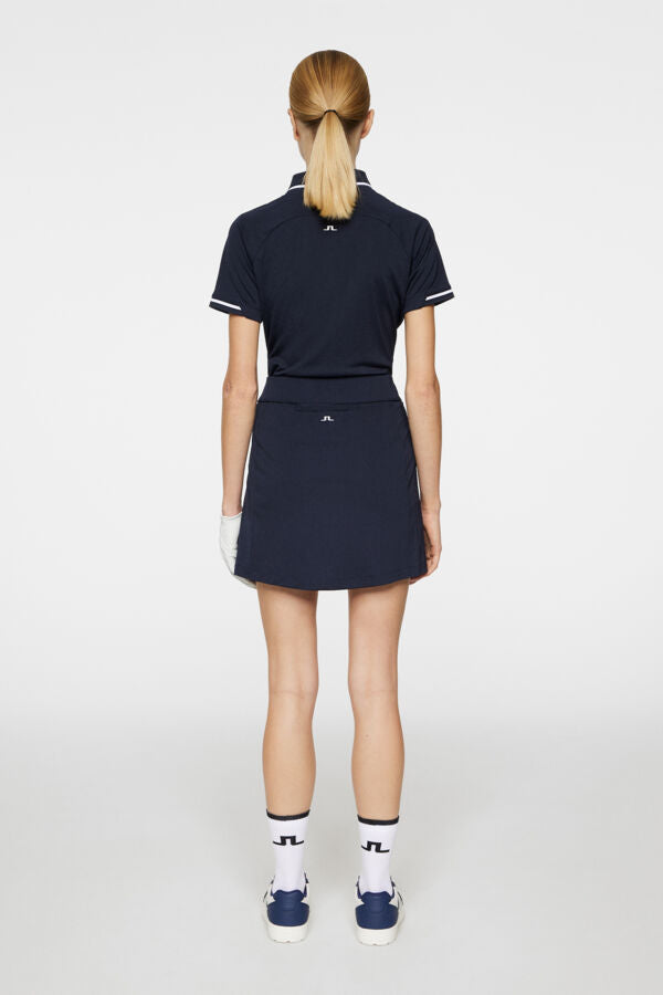 J.LINDEBERG AMELIE MID GOLF SKIRT JL NAVY