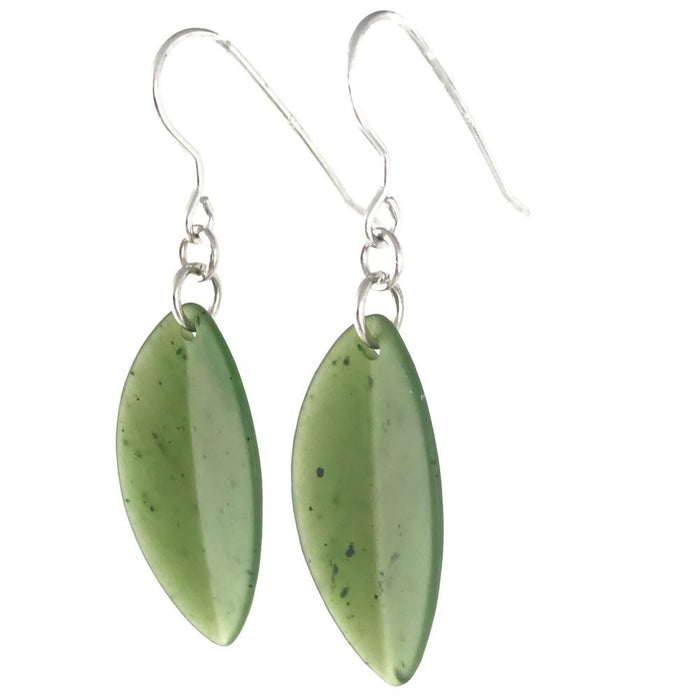 Close up of green leaf shaped gemstone earrings with silver ear wires
