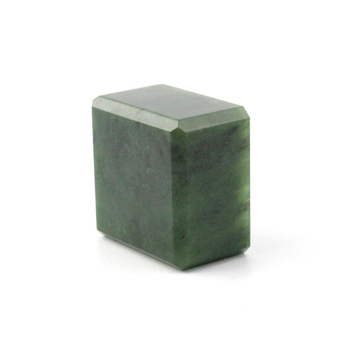 Dark green rectangular stone with a beveled top edge set against a white studio backdrop.