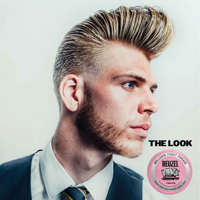 Mann i dress med høyt strøket hår og Reuzel Pomade Pink boks med 'THE LOOK'