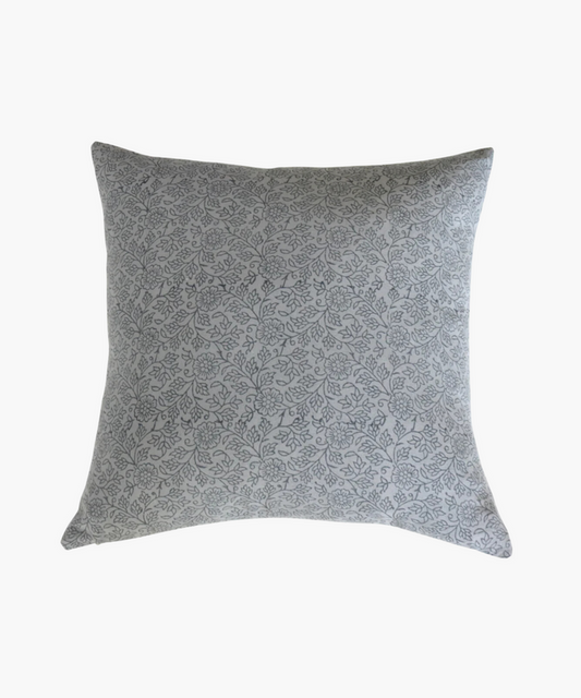 A square pillow with a delicate gray floral pattern on a light background. The design features intertwined flowers and leaves, conveying a soft, elegant feel. | Wildwood Home Co.