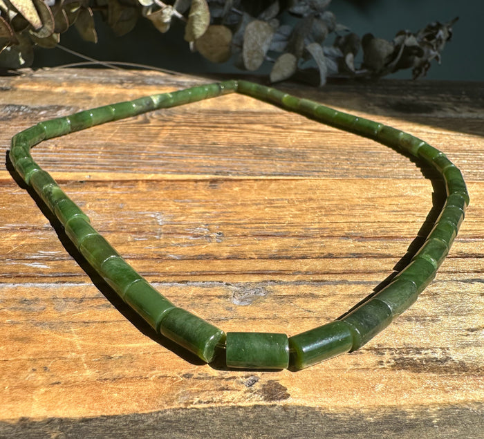 Siberian jade tube bead necklace with cylindrical green beads on an 18 inch strand.
