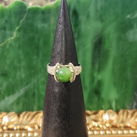 Silver Canadian Jade Star Ship Ring with a round green jade cabochon in a starship setting