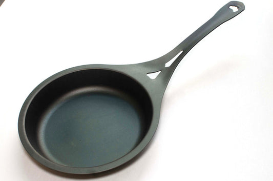 Seasoned Carbon Steel Black Skillet on a white background.