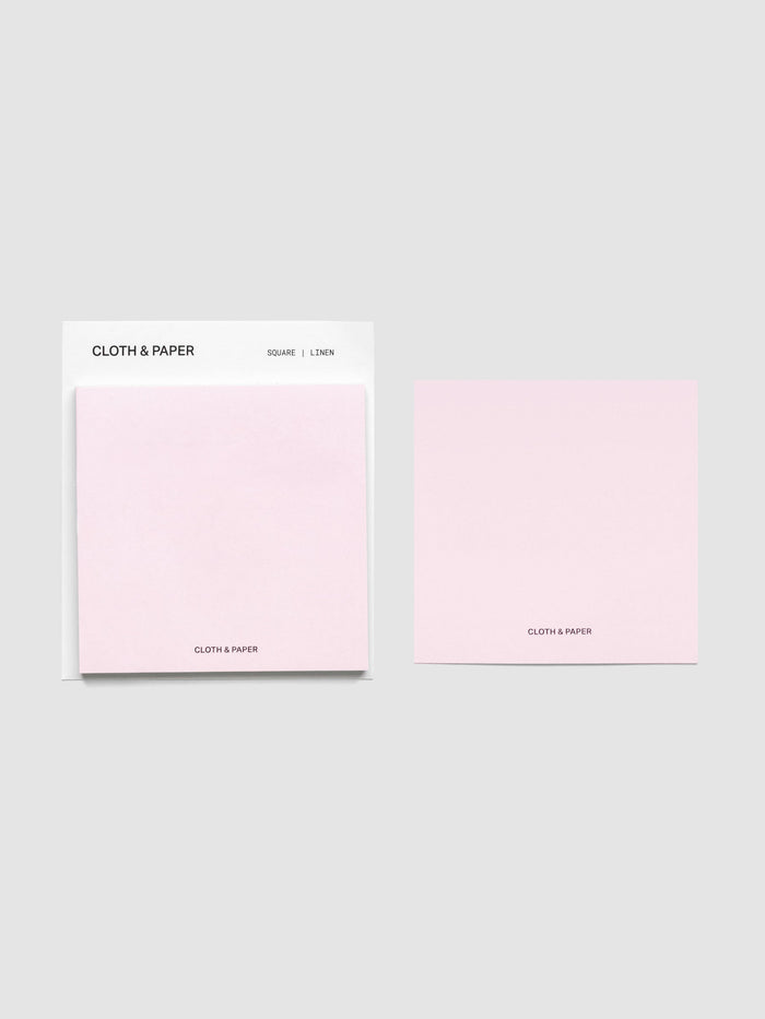Sticky note set displayed against a neutral background. One note is placed on the packaging's edge. Color shown is Linen.