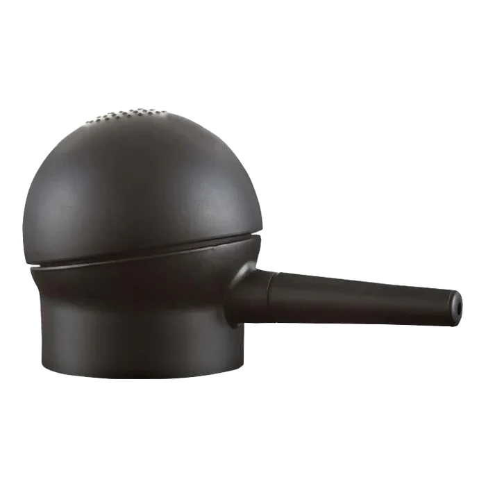 Svart Toppik hårfiber-applikator med ergonomisk design og hull for presis påføring