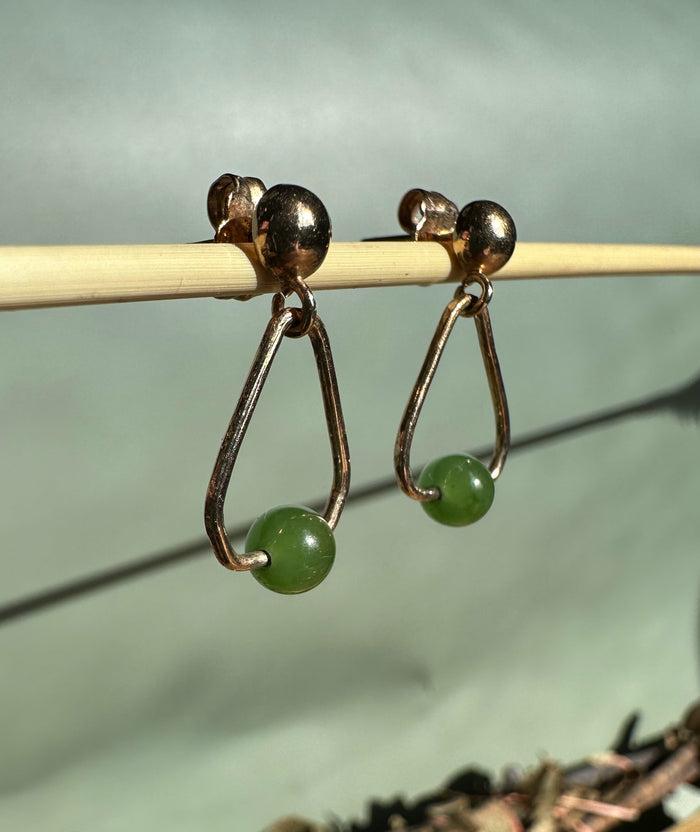 Vintage jade earrings with gold-toned triangular frames and green round beads