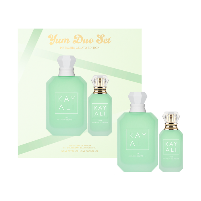 Kayali perfume set with four bottles and packaging on a light green background